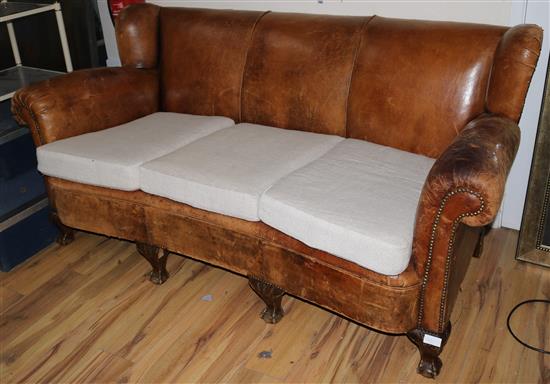 A brown leather upholstered three seater settee, W.195cm